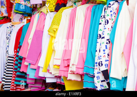 a lot of clothes on a hanger Stock Photo