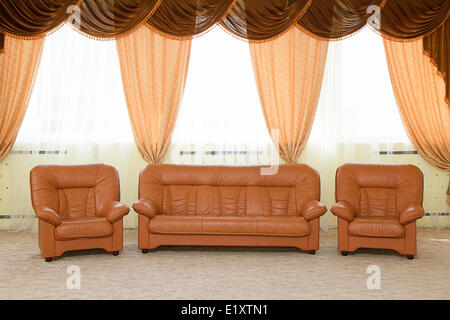 Leather armchairs and a sofa Stock Photo