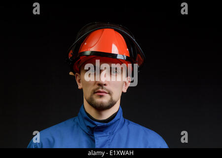 The worker in overalls Stock Photo