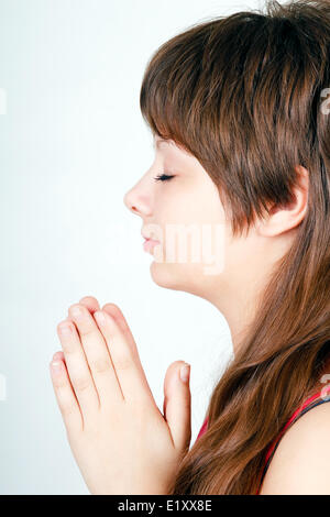 ger girl folded her hands in prayer Stock Photo