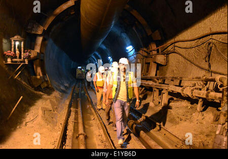 Srinagar, Indian Administered Kashmir. 11 June 2014.A view of a tunnel during the breakthrough of headrace tunnel in Bandipora 100 km north of Srinagar The 23.65 km tunnel, 14.75 km was constructed using a tunnel boring machine (TBM), the first successful TBM operation to create a headrace tunnel. India's infrastructure major Hindustan Construction Company, along with United Kingdom company Halcrow, is executing the 330 mw Kishanganga hydroelectric power project in the region. Credit:  sofi suhail/Alamy Live News Stock Photo