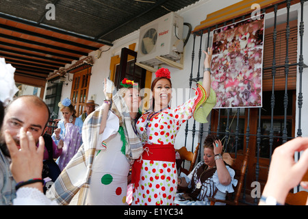 Woman dancing Andalusian style at the Rocio Romeria Catholic festival in the village of El Rocio, Southern Spain Stock Photo