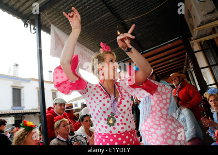 Woman dancing Andalusian style at the Rocio Romeria Catholic festival in the village of El Rocio, Southern Spain Stock Photo