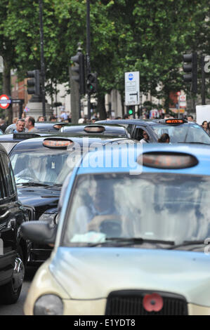 Whitehall, London, UK. 11th June 2014. Taxi drivers stage a mass protest against the Uber App, filling the streets bringing the center of London to a standstill. Credit:  Matthew Chattle/Alamy Live News Stock Photo