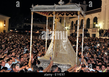 Thousands gather to touch the Virgin of El Rocío during the Romeria processionin Rocio in the province of Huelva, Andalusia Stock Photo