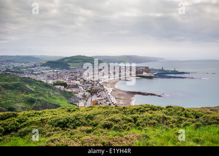 A view from the top of Constitution hill overlooking the coastal resort of Aberystwyth with sandy beach and Cardigan bay. Stock Photo