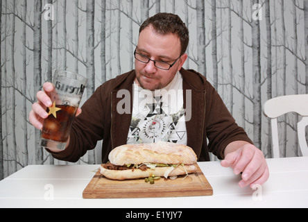 Man eating a huge Sandwich Stock Photo