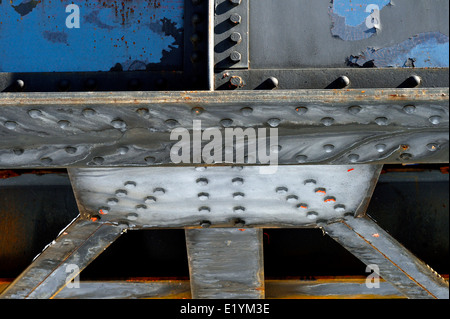 Steel girders bolted together to make the foundation of a train bridge Stock Photo