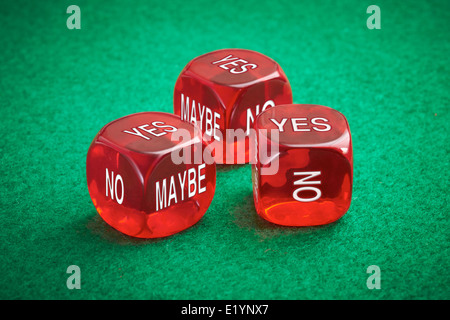 Chance concept, three red dice on a green felt background. Stock Photo