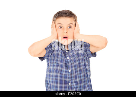 Shocked boy covering his ears Stock Photo