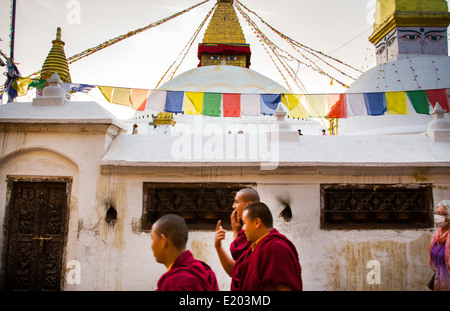 Kathmandu Nepal three monks walking at the Boudhanath Stupa Stock Photo