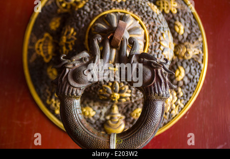 Kathmandu Nepal Ornate door handle at the Drikung Kagyu Rinchenling monastery. Eastern Kathmandu Stock Photo