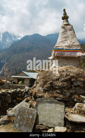 Nepal A Stupa standing over a Mani Wall in the village of Thamo with Sherpa houses in the background remote, Mt Everest, Stock Photo