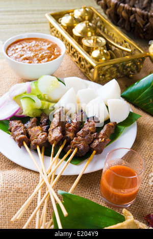 beef satay with traditional background setting Stock Photo