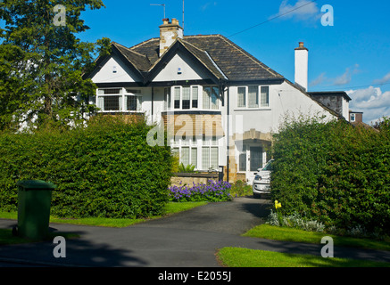 Typical suburban semi-detached houses, in Adel, near Leeds, West Yorkshire, England UK Stock Photo