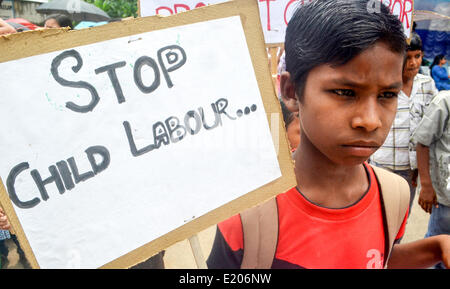 Guwahati-Assam, India. 11th June, 2014. Children participating in the mass awareness campaign against employment of child labour on the day of “World Day against Child Labour”  by Office of the Asst. Labour Commissioner of Kamrup district, Guwahati-Assam. This year, World Day Against Child Labour draws attention to the role of social protection in keeping children out of child labour and removing them from it. Credit:  PACIFIC PRESS/Alamy Live News Stock Photo