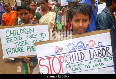 Guwahati-Assam, India. 11th June, 2014. Children participating in the mass awareness campaign against employment of child labour on the day of “World Day against Child Labour”  by Office of the Asst. Labour Commissioner of Kamrup district, Guwahati-Assam. This year, World Day Against Child Labour draws attention to the role of social protection in keeping children out of child labour and removing them from it. Credit:  PACIFIC PRESS/Alamy Live News Stock Photo