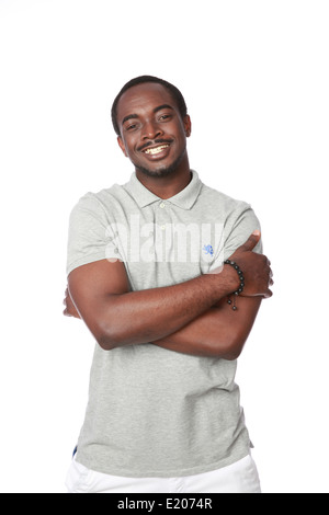Cheerful african man standing with arms folded over white background Stock Photo