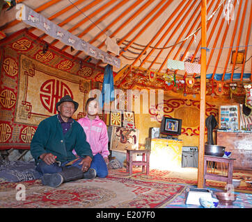 Mongolian man, 85 years, with granddaughter, 9 years, in a traditional yurt, Gobi Desert, Ömnögovi Province, Mongolia Stock Photo