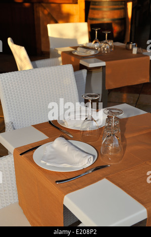 Restaurant table with place setting for two Stock Photo