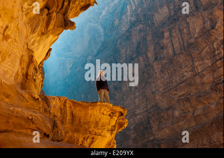 A local guide enjoys the view in Wadi Rum (The Valley Of The Moon), Jordan, Middle East Stock Photo