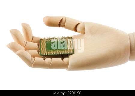 Wooden hand holding a processor Stock Photo