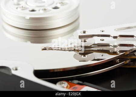 Platters and head of a computer hard drive Stock Photo