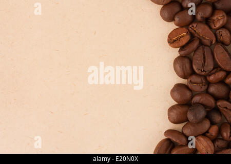 Coffee beans on old paper background Stock Photo