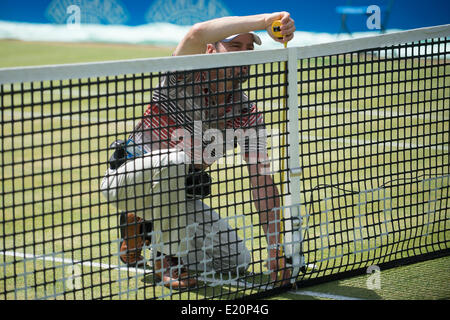 London, UK. 12th June, 2014. Grounds set up the net height prior to play on day four of The Aegon Championships from The Queens Club. Credit:  Action Plus Sports Images/Alamy Live News Stock Photo