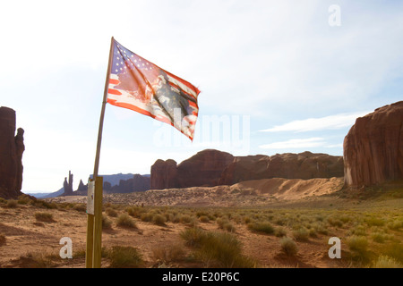 Navajo Nation flag against a backdrop of rock mesa formations in the desert southwest America Stock Photo