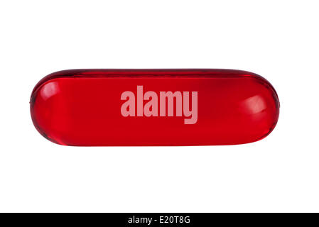 Red pill close up isolated on white. Stock Photo