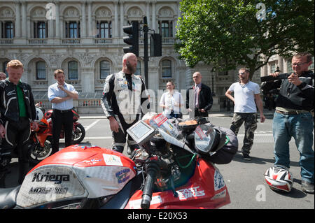 Whitehall, London, UK. 12th June 2014. Since October 2012 Bruce Smart has been riding a Suzuki GSX-R1000 around the world in an attempt to raise awareness and £70K for 5 charities: The St Christopher’s Hospice, The Children’s Trust, The Lymphoma Association, Born Free Foundation, and The Royal British Legion. Today Bruce completed his mammoth test of endurance, finally reaching his destination at 10 Downing Street, London. Credit:  Lee Thomas/Alamy Live News Stock Photo