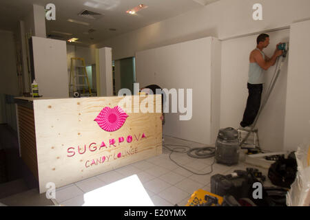 Wimbledon London UK. 12th June 2014. Workers put the finishing touches to the new Maria Sharapova candy store named 'Sugarpova' before the opening Credit:  amer ghazzal/Alamy Live News Stock Photo