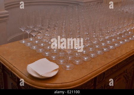 Empty champagne glasses on a marble table for buffet Stock Photo
