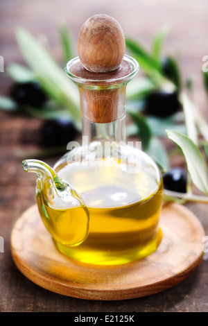 bottle of olive oil and an olive brunch Stock Photo