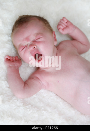 Yawning newborn baby Stock Photo