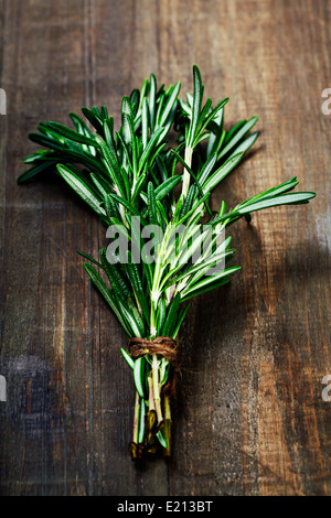 Rosemary bound on a wooden board Stock Photo