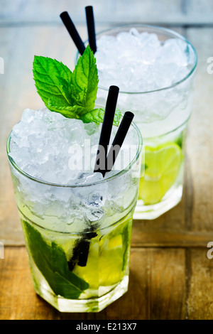 Mojito cocktail with ingredients on wooden background Stock Photo
