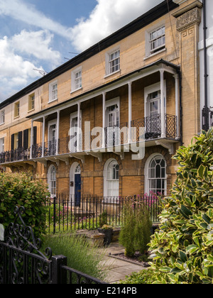 Row of old Regency style stone terraced houses with balconies, Stamford, Lincolnshire, England, UK Stock Photo