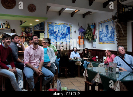 People watching football soccer on Television (  FIFA World Cup Brazil ) Bar Pub Cafe  Arcos de Frontera Spain Spanish Cadiz Stock Photo