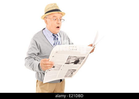 Surprised senior gentleman reading the news Stock Photo