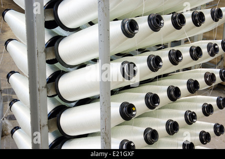 Bobbins weaver's manufacture. Of these strings make a cloth Stock Photo