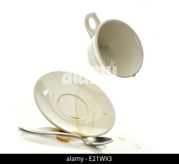 Cup and saucer with spilled coffee Stock Photo