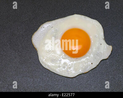 a fried egg in a pan Stock Photo