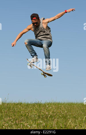 Skateboarder leaping in the air Stock Photo