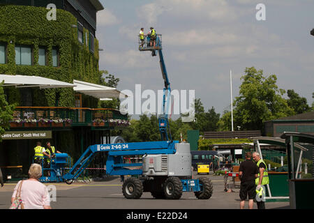 Wimbledon London 13th June 2014. Workers on a cherry picker at the AELTC All England Lawn Tennis Club ahead of the 2014 lawn tennis championships Credit:  amer ghazzal/Alamy Live News Stock Photo
