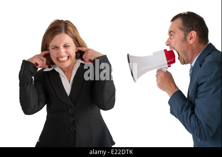 businesswoman being yelled at by male manager businessman through a loudhailer or megaphone isolated on white Stock Photo