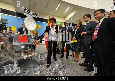 (140613) -- VIENNA, June 13, 2014 (Xinhua) -- A Chinese staff member introduces the replica of lunar rover Yutu, the Jade Rabbit, to visitors at Vienna International Center, in Vienna, Austria, June 13, 2014. China National Space Administration donated a replica of which the exact same size as the real lunar rover Yutu to the United Nations aerospace bureau here on Friday.Lunar probe Chang'e-3 with rover Yutu on board, landed on the moon's Sinus Iridum in 2013, making China the third country to put a rover on the moon after the United States and Soviet Union. (Xinhua/Qian Yi) Stock Photo