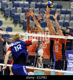 Left to right: Michal Krisko (CZE) and Nimir Abdel-Aziz, Jasper Diefenbach and Jeroen Rauwerdink (all NDL) pictured during the match of the group E of the Volleyball World League Czech Republic vs Netherlands in Chomutov, Czech Republic, June 13, 2014. (CTK Photo/Libor Zavoral) Stock Photo