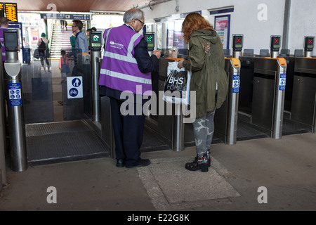 Passenger undergoing Ticket Inspection at Oxford road railway station, Manchester, UK Stock Photo